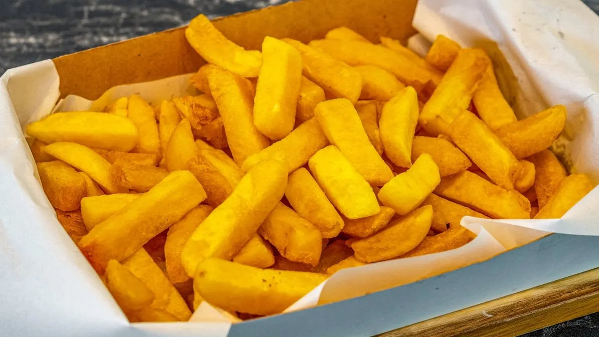 Battered seafood pieces on a dark marble board