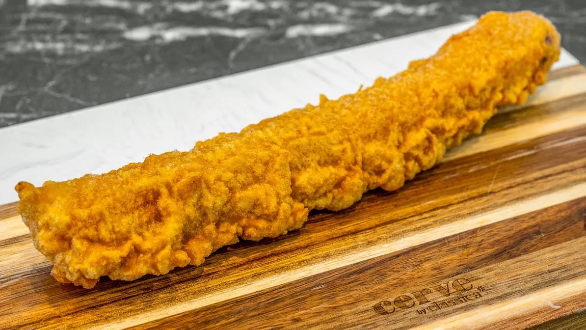 Burger with the lot on a serving board